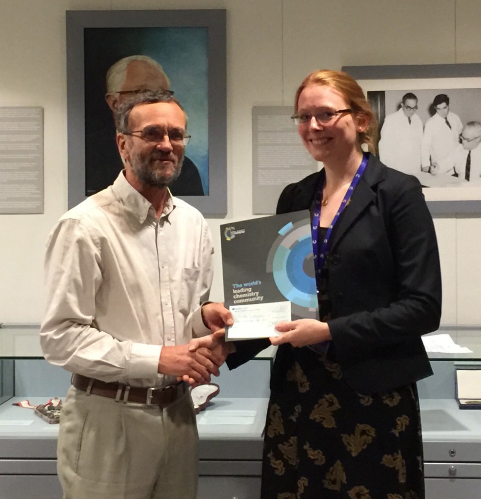 Oral presentation winner Charlotte Sutherell being presented with her award
